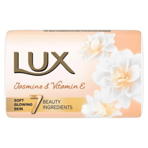 Lux Jasmine & Vitamin E soap bar with white flowers on peach background, promotes soft glowing skin and 7 beauty ingredients - Lux Soap Bright Glow Jasmin 100Gm
