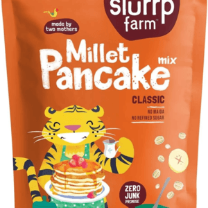 Pouch of Slurrp Farm Millet Pancake mix in orange packaging, showing a cartoon tiger and stack of pancakes with toppings. - Slurrp Farm Millet Pancake Mix Classic 150g