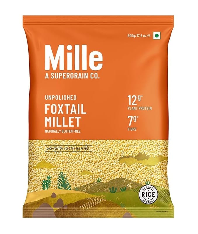 Package of Millet foxtail millet flour/grain: orange bag with 'Mille' branding and nutrition facts (12g protein, 7g fibre) visible, rice-like millet inside panel artwork (100% gluten free)
