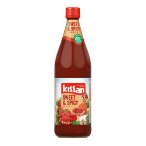 Bottle of Kissan Sweet & Spicy sauce with red cap, front label visible - Kissan Tomato Ketchup(Sweet & Spicy) 500Gm