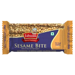 Front of an orange Labsons Sesame Bite snack wrapper filled with sesame seeds, featuring the Labsons logo and a cartoon chef. - Jabsons Chikki Sesame (Brittle) 28gm