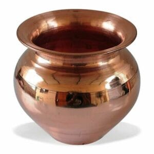 Polished copper pot with a wide rim and rounded body on a white background, reflecting its surroundings. - Vego Copper Lota No 7