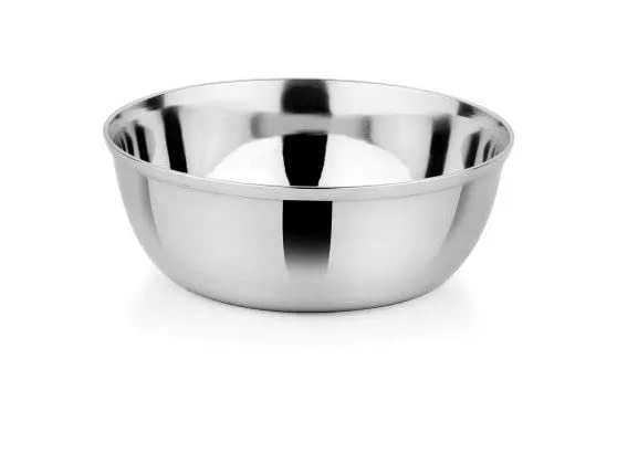 Stainless steel mixing bowl on a white background, empty and polished to a reflective shine.
